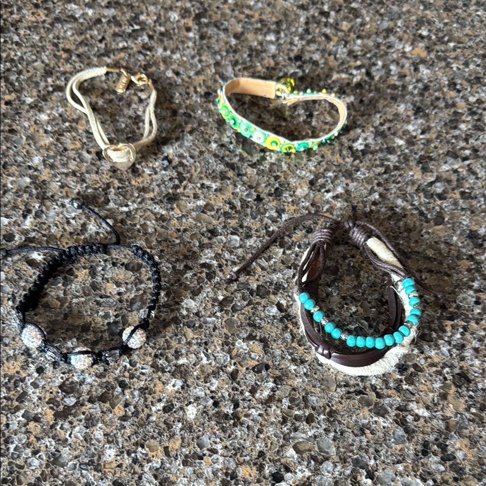 Set of Four Bracelets - at least 1 AERO bracelet - 2 adjustable from small-large